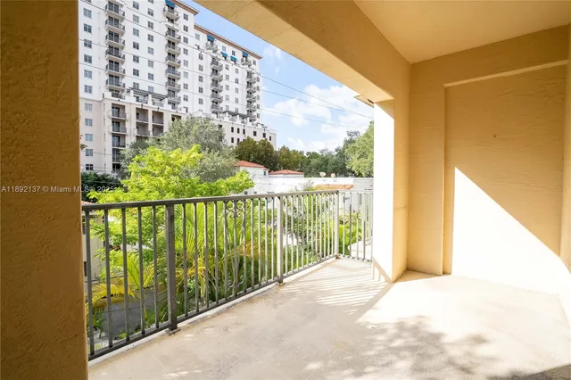 an empty room with an entrance to other room