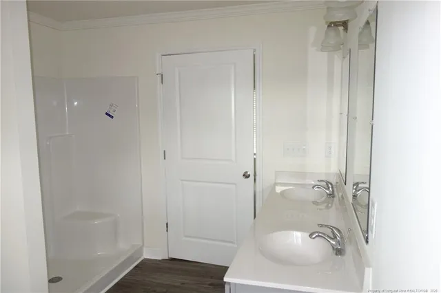 a bathroom with a granite countertop sink