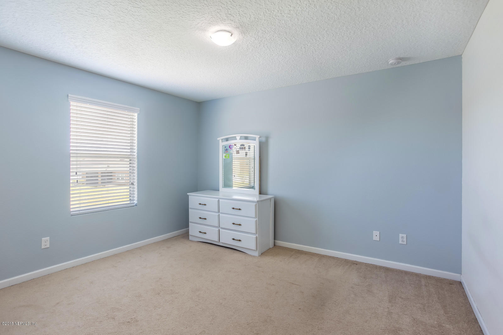 16415 Tisons Bluff Road Jacksonville, FL 32218 - Photo 17 of 38 an empty room with windows