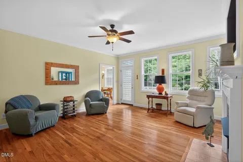 a living room with furniture fireplace and flat screen tv