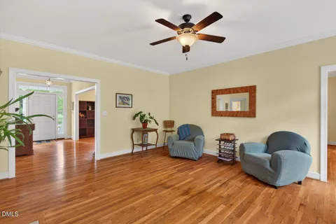a living room with fireplace furniture and a flat screen tv