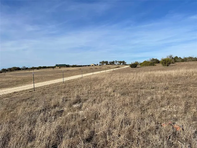 a view of a yard with an ocean view