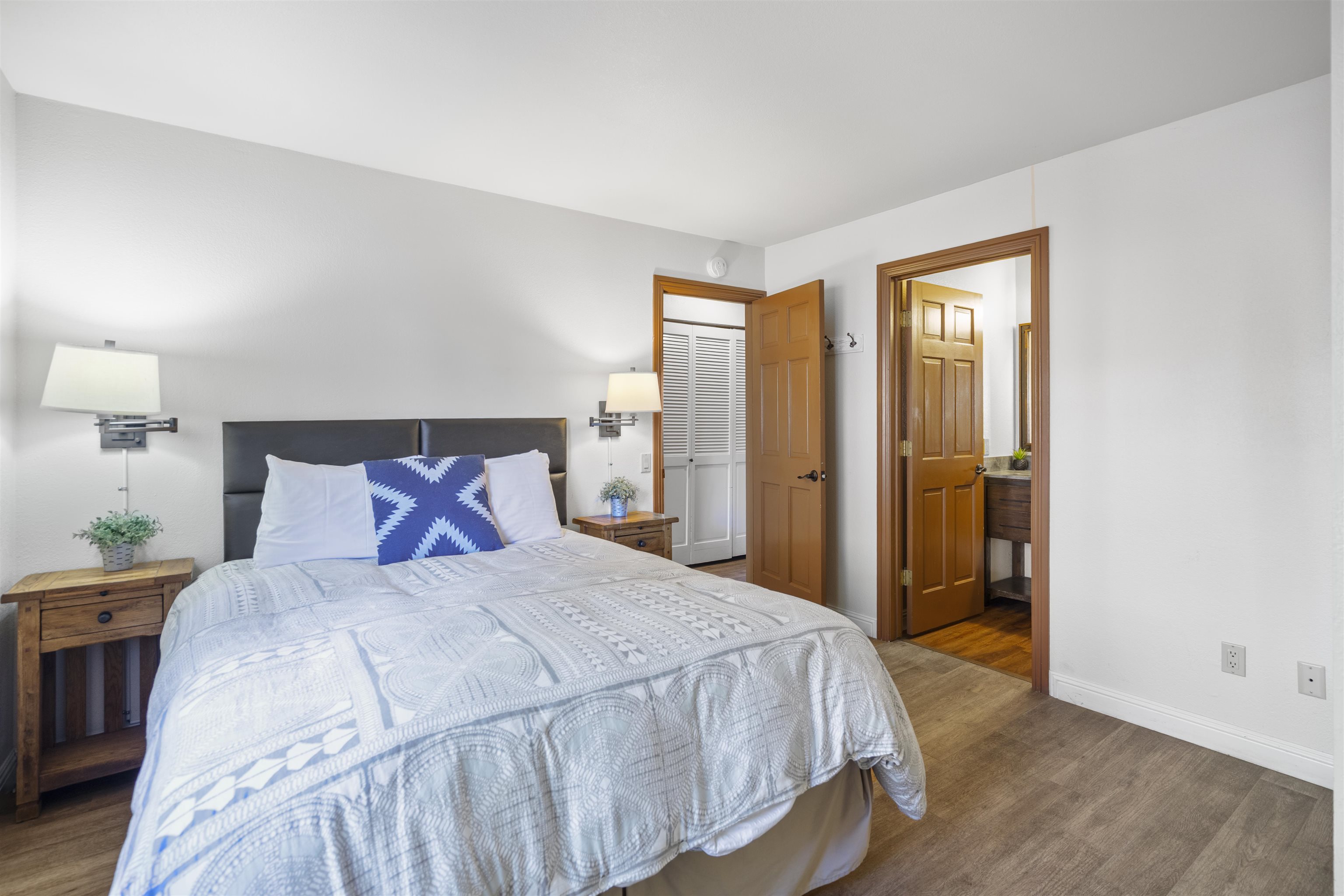 4710 Minaret Road, Unit 3 Mammoth Lakes, CA 93546 - Photo 11 of 30 a bedroom with a large bed and a closet