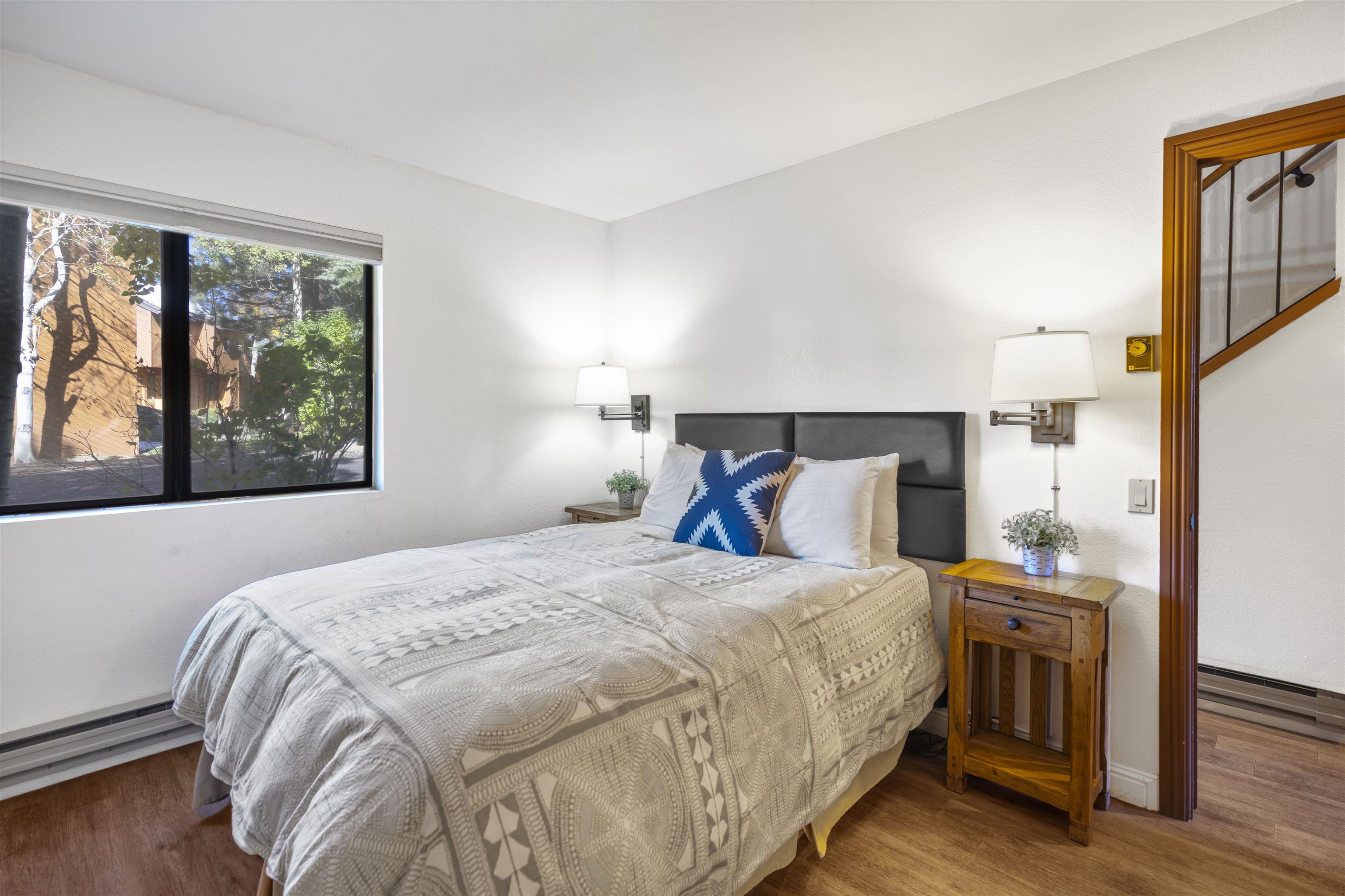 4710 Minaret Road, Unit 3 Mammoth Lakes, CA 93546 - Photo 12 of 30 a bedroom with a bed and a large window