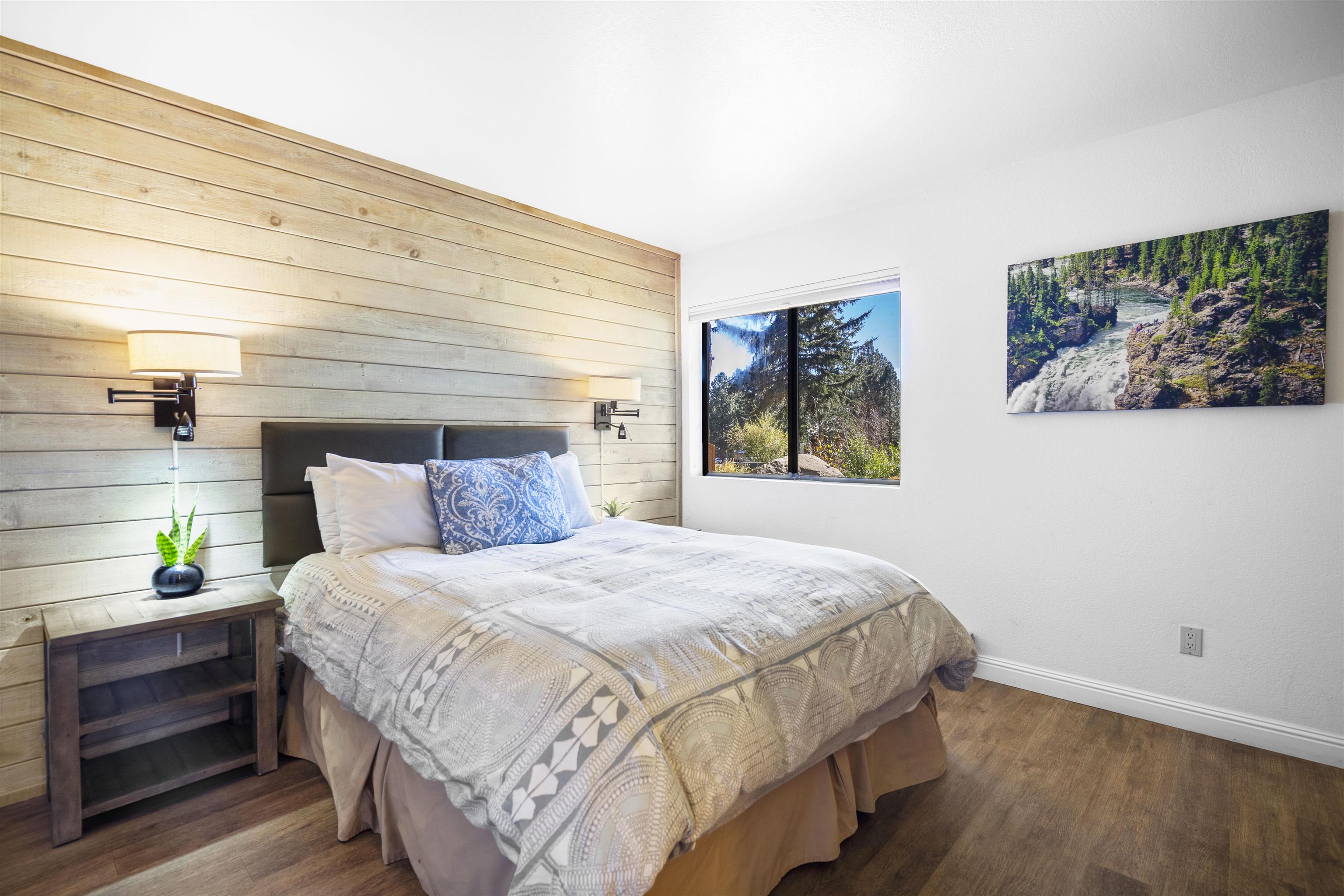 4710 Minaret Road, Unit 3 Mammoth Lakes, CA 93546 - Photo 15 of 30 a bedroom with a bed and painting on the wall