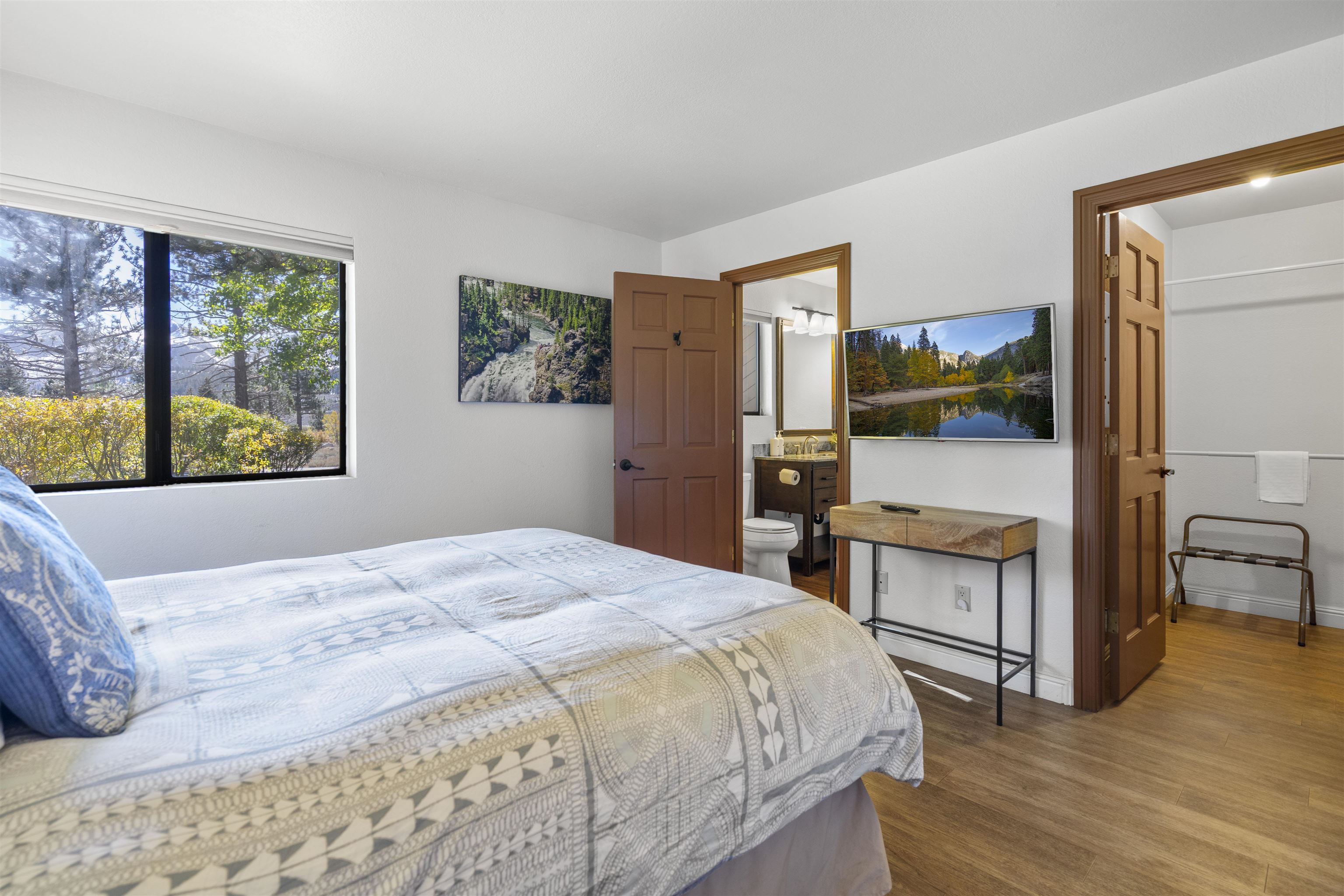 4710 Minaret Road, Unit 3 Mammoth Lakes, CA 93546 - Photo 17 of 30 a bedroom with a bed and a flat screen tv