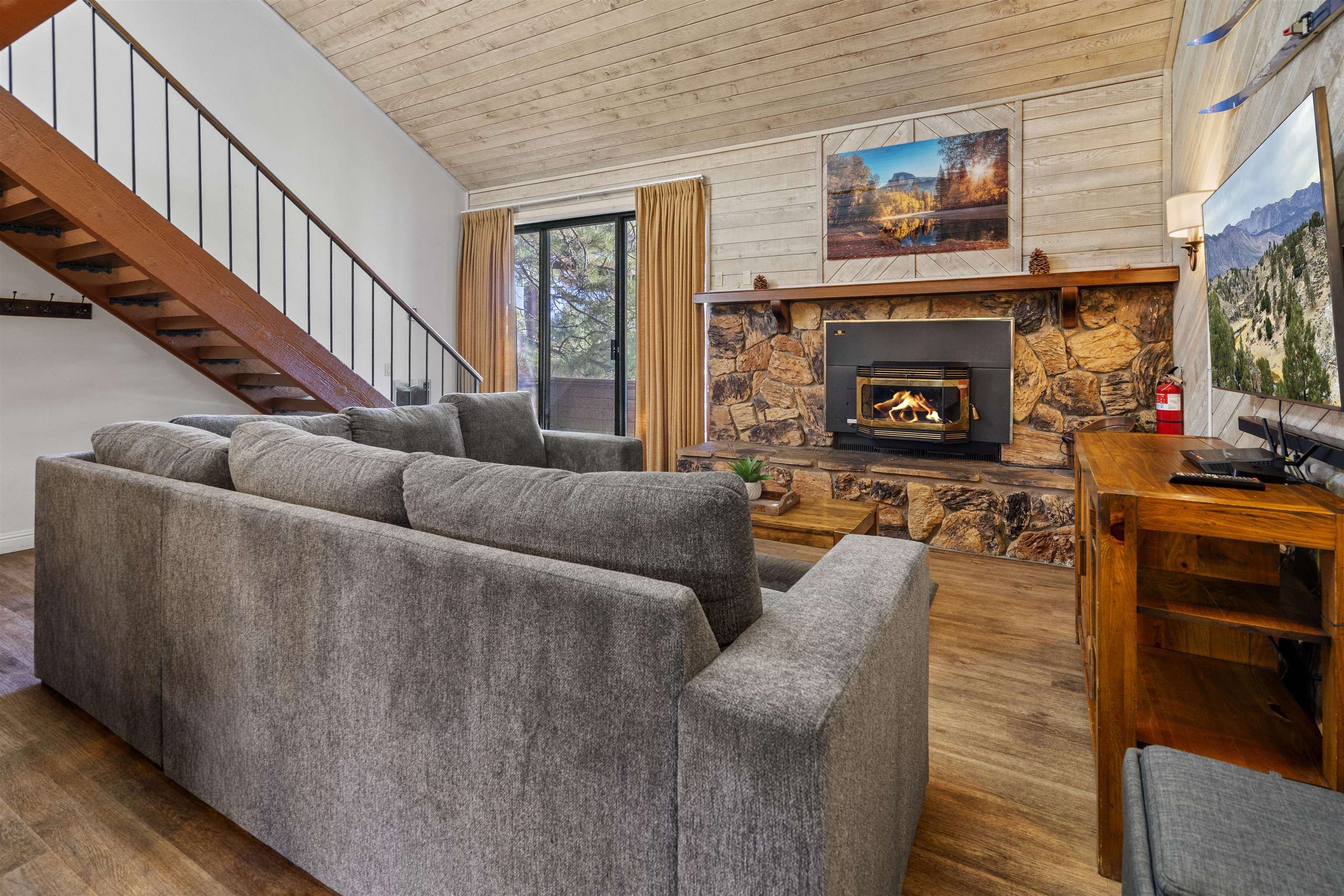 4710 Minaret Road, Unit 3 Mammoth Lakes, CA 93546 - Photo 2 of 30 a living room with furniture and a fireplace