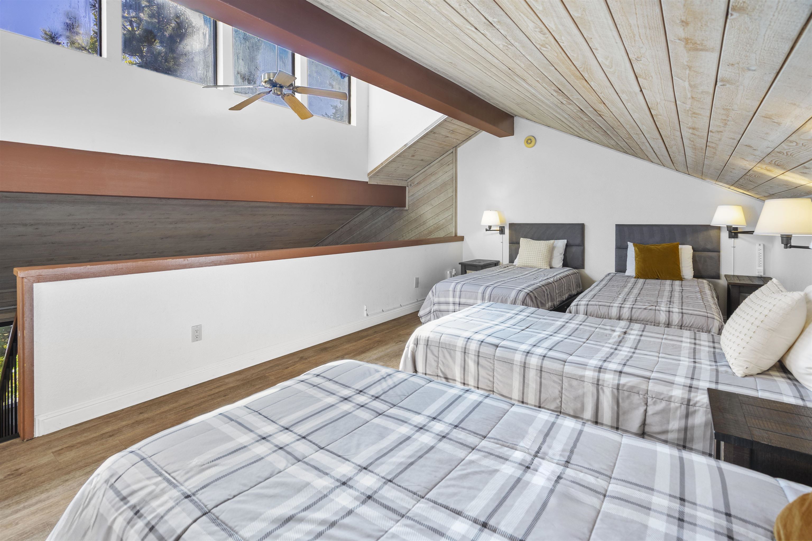 4710 Minaret Road, Unit 3 Mammoth Lakes, CA 93546 - Photo 22 of 30 a bedroom with bed and wooden floor