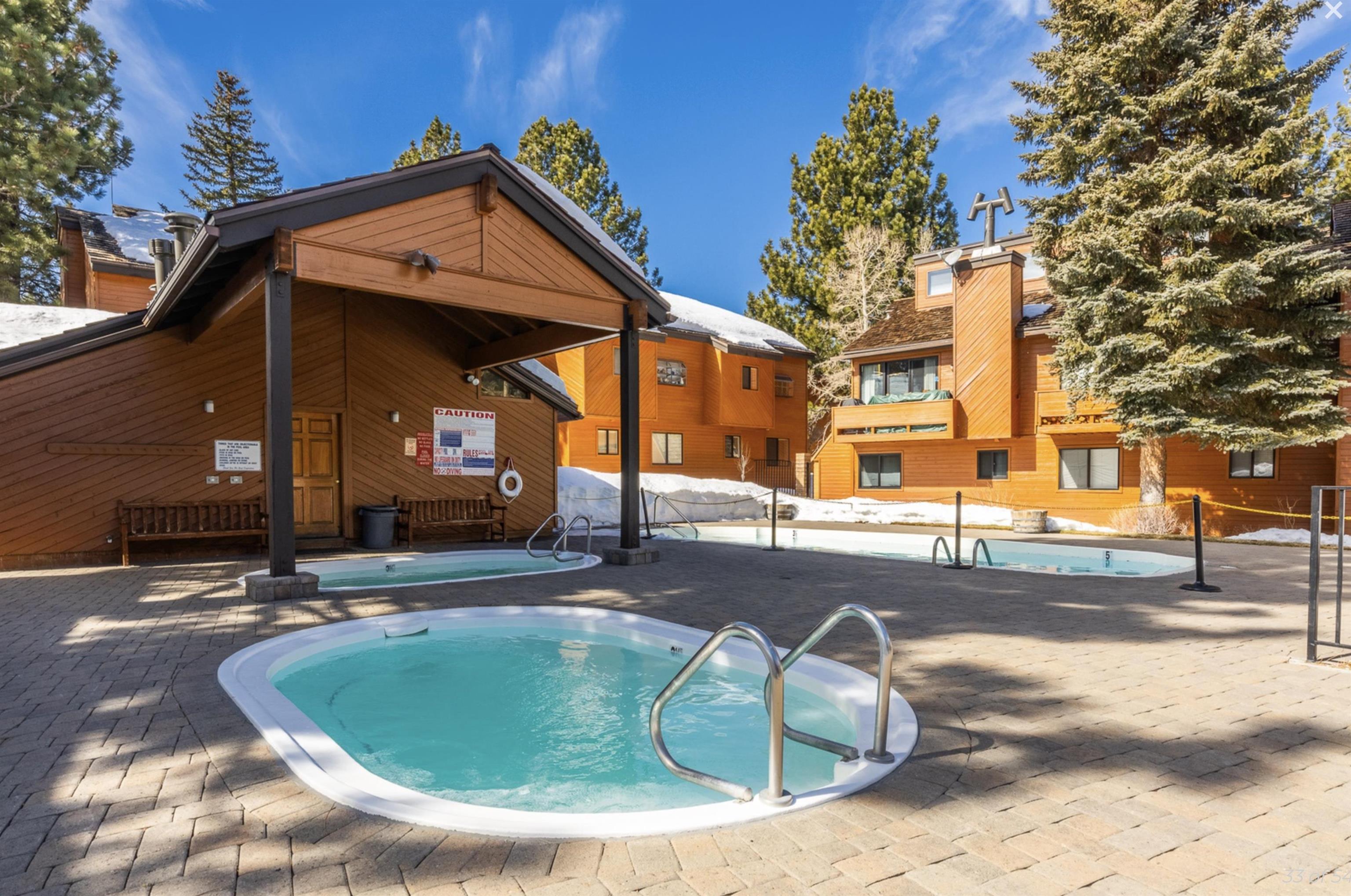 4710 Minaret Road, Unit 3 Mammoth Lakes, CA 93546 - Photo 23 of 30 a view of a house with a swimming pool