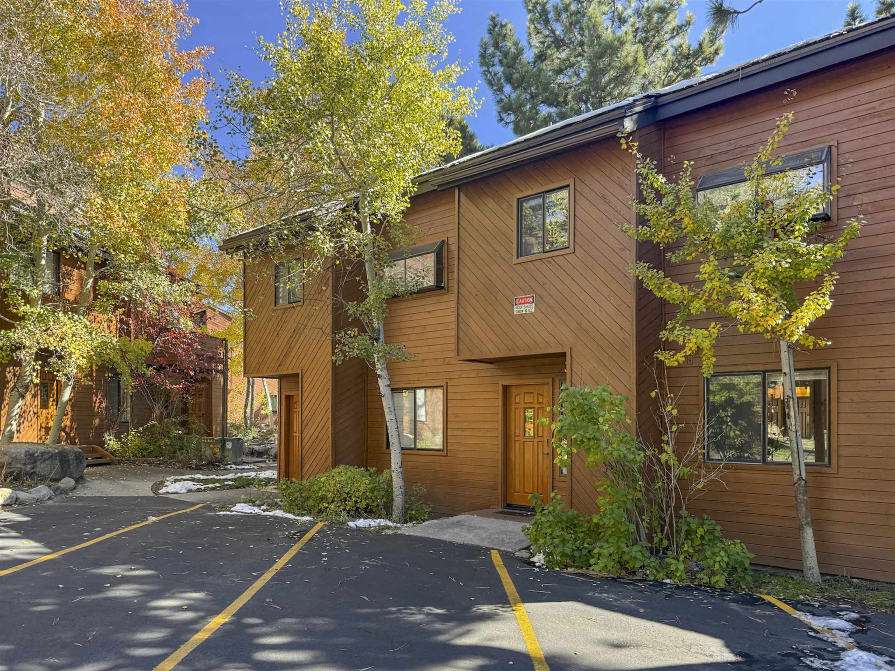 4710 Minaret Road, Unit 3 Mammoth Lakes, CA 93546 - Photo 30 of 30 a front view of a house with a yard and garage