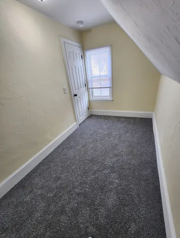 an empty room with a hallway