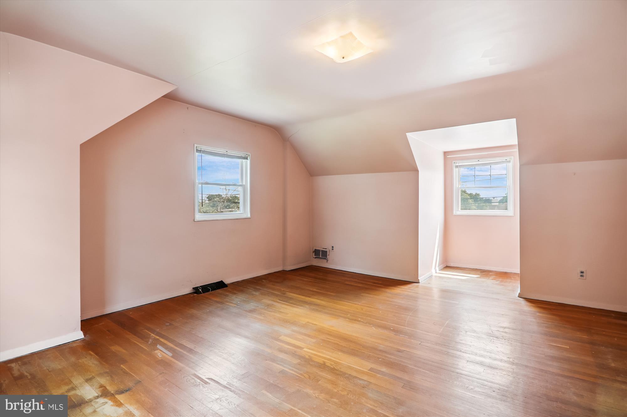 9507 Adelphi Road Silver Spring, MD 20903 - Photo 29 of 41 an empty room with wooden floor and windows
