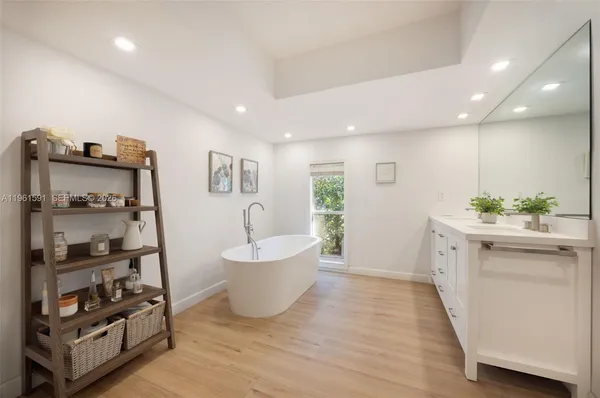a bathroom with a bathtub and a shower