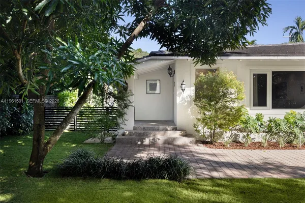 a view of a house with a garden