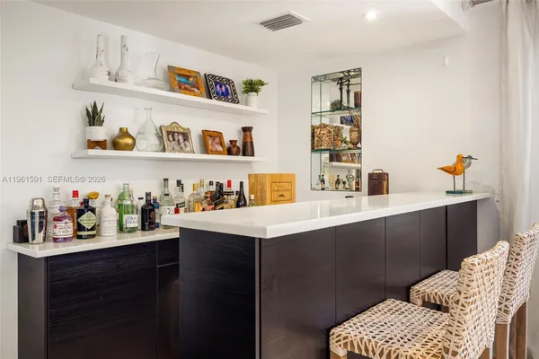 a kitchen with a sink a stove a refrigerator and cabinets