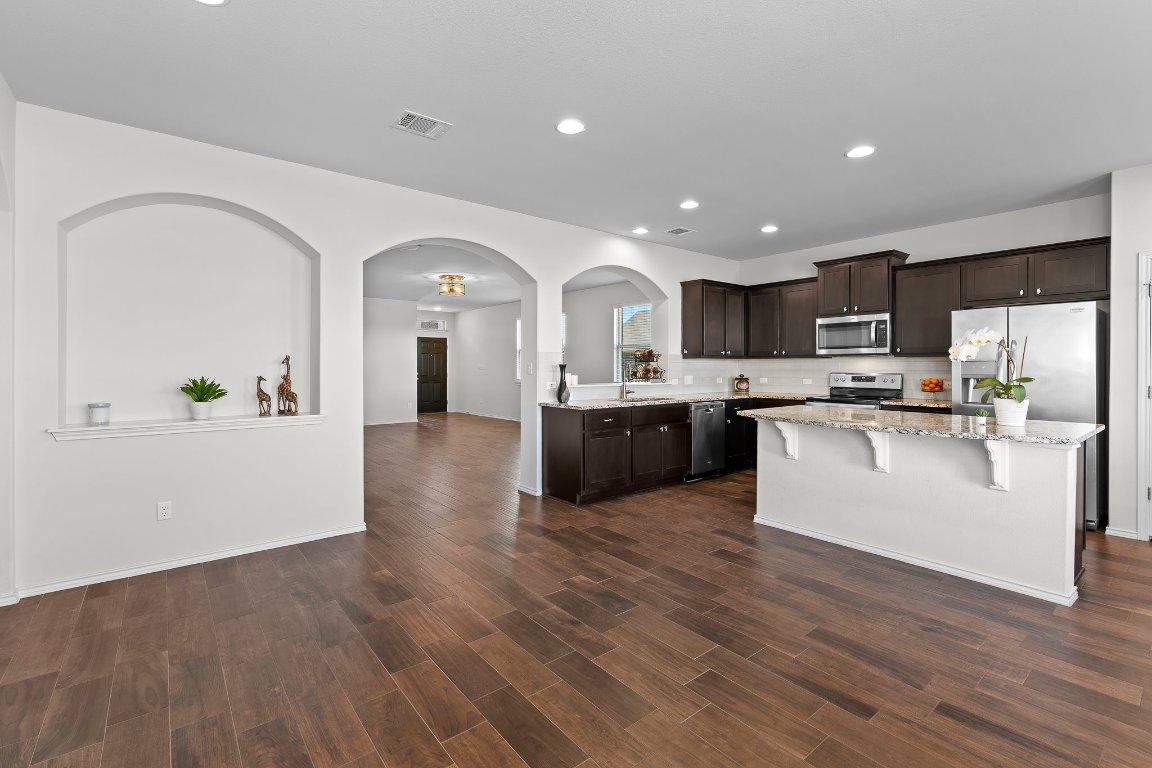 704 Coltrane Drive Pflugerville, TX 78660 - Photo 39 of 39 a view of kitchen with sink and wooden floor