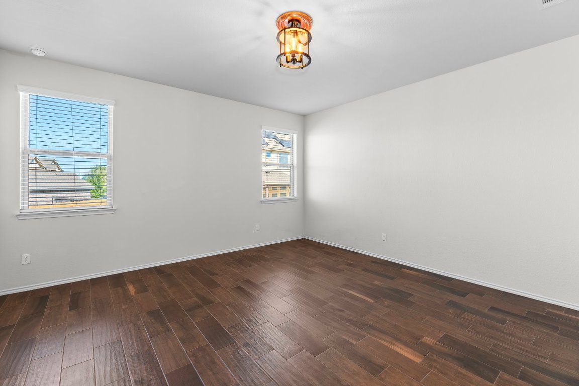 704 Coltrane Drive Pflugerville, TX 78660 - Photo 23 of 39 an empty room with window