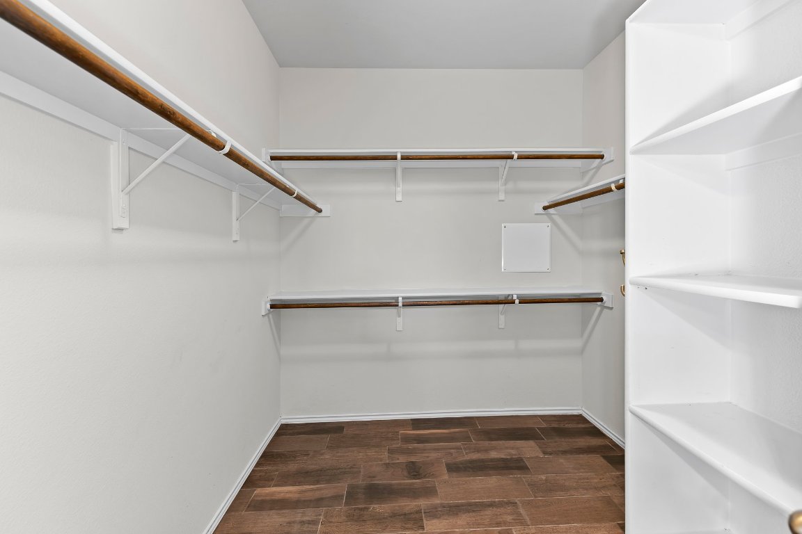 704 Coltrane Drive Pflugerville, TX 78660 - Photo 27 of 39 a view of an empty walk in closet