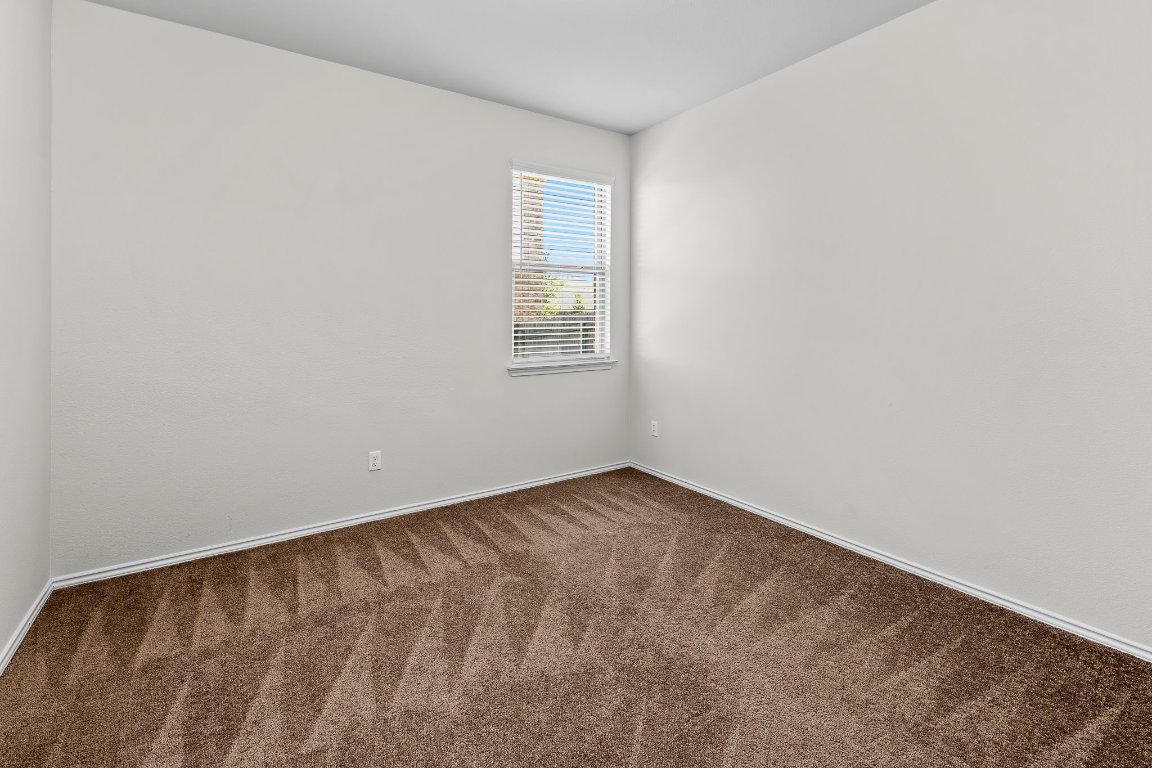 704 Coltrane Drive Pflugerville, TX 78660 - Photo 29 of 39 an empty room with a window