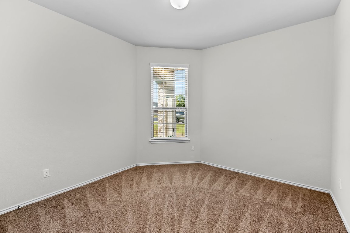 704 Coltrane Drive Pflugerville, TX 78660 - Photo 32 of 39 an empty room with a window