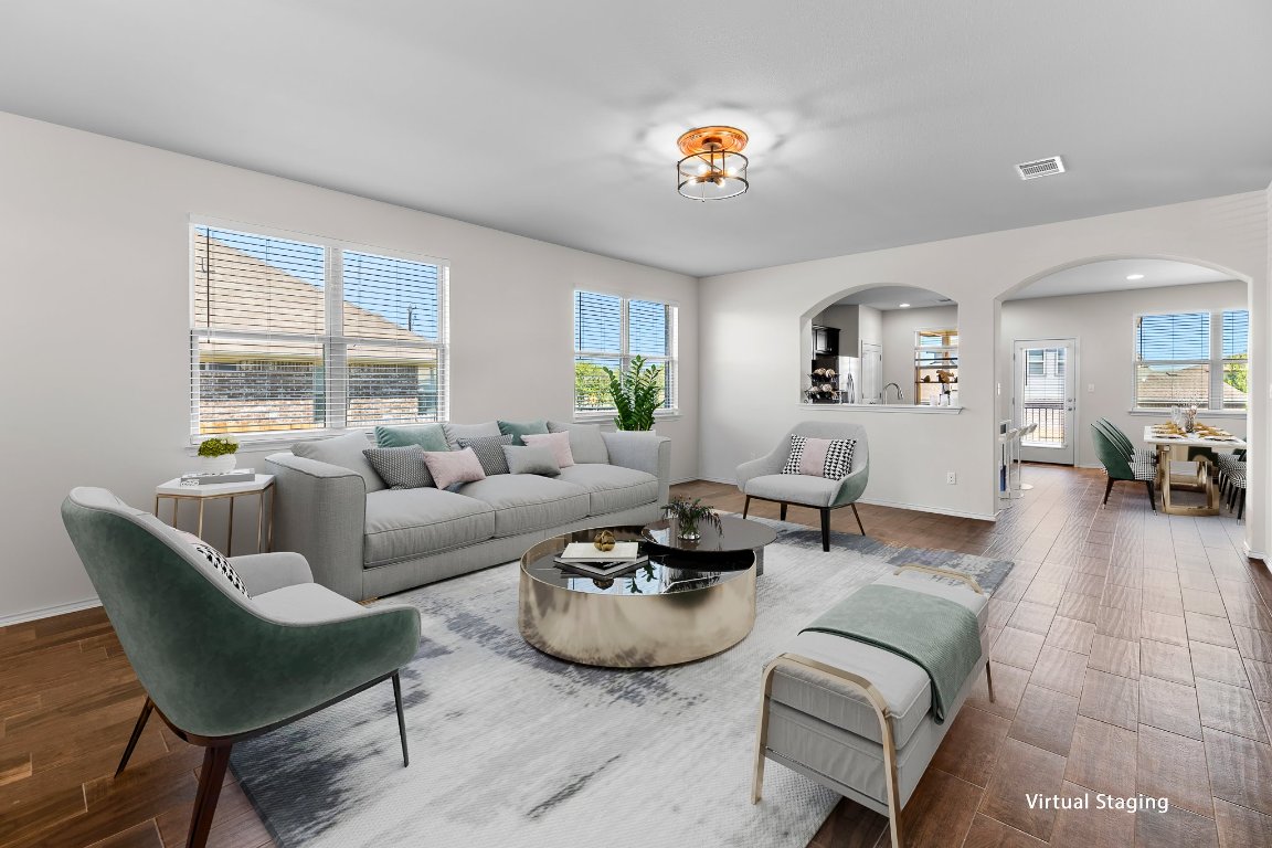 704 Coltrane Drive Pflugerville, TX 78660 - Photo 5 of 39 a living room with furniture and a large window