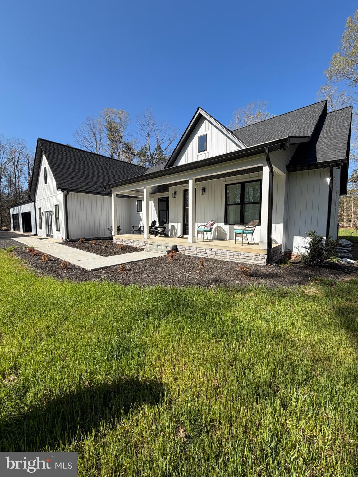 26340 Old Mill Road Unionville, VA 22567 - Photo 1 of 3 a front view of a house with a yard
