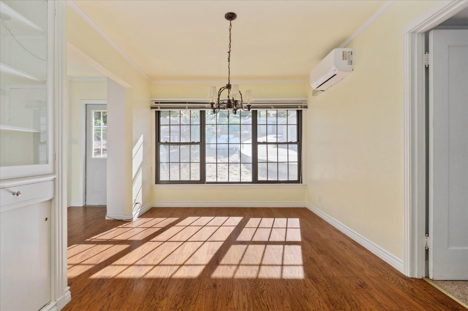 1575 South Main Street Angels Camp, CA 95222 - Photo 12 of 39 a view of an empty room with glass door and windows