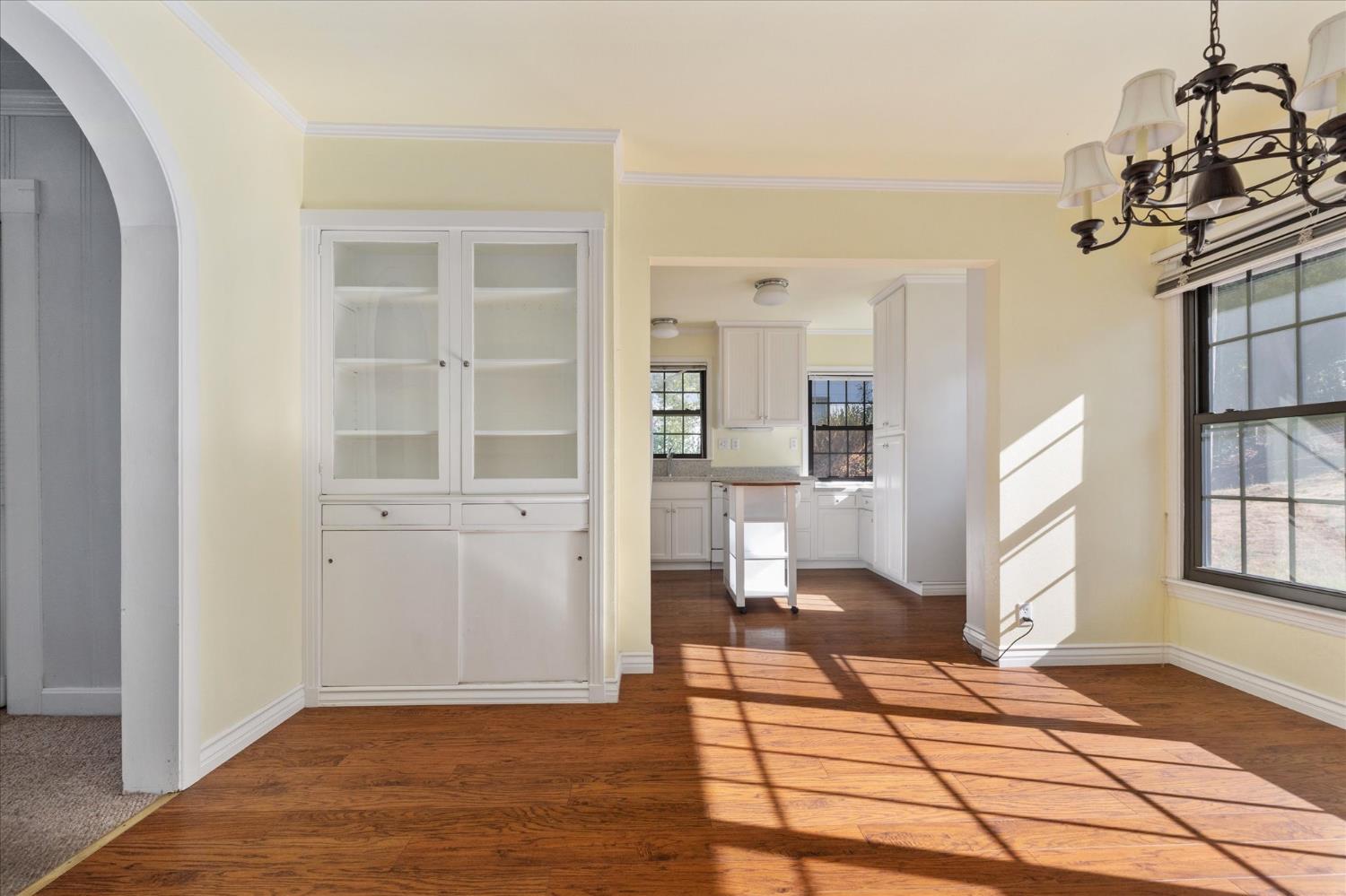 1575 South Main Street Angels Camp, CA 95222 - Photo 14 of 39 a view of a livingroom with wooden floor and a large window