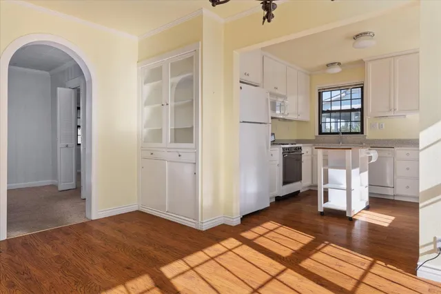a kitchen with stainless steel appliances granite countertop refrigerator sink and cabinets