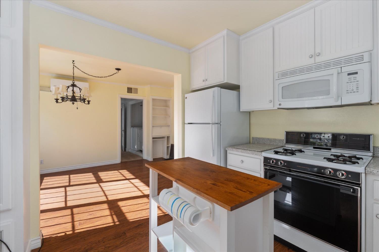1575 South Main Street Angels Camp, CA 95222 - Photo 18 of 39 a kitchen with a stove and a refrigerator