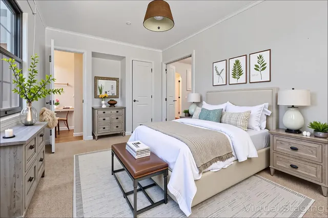 a spacious bedroom with a bed and window