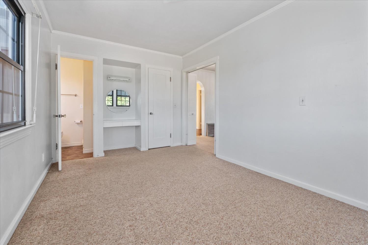 1575 South Main Street Angels Camp, CA 95222 - Photo 21 of 39 an empty room with closet and windows