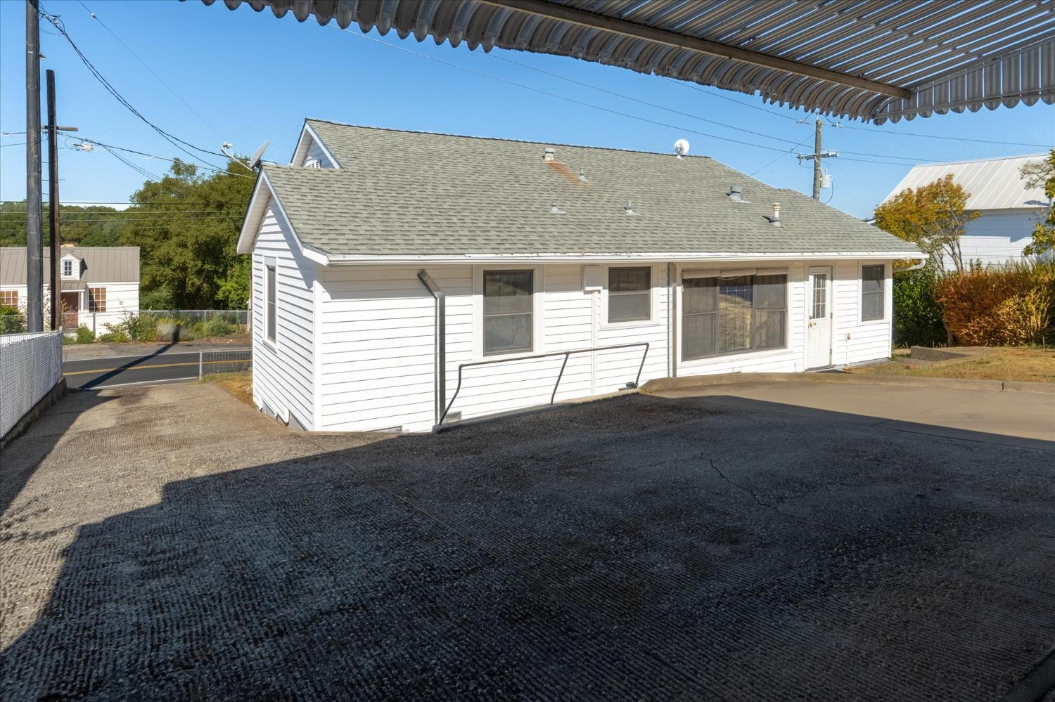 1575 South Main Street Angels Camp, CA 95222 - Photo 29 of 39 a front view of a house with a yard