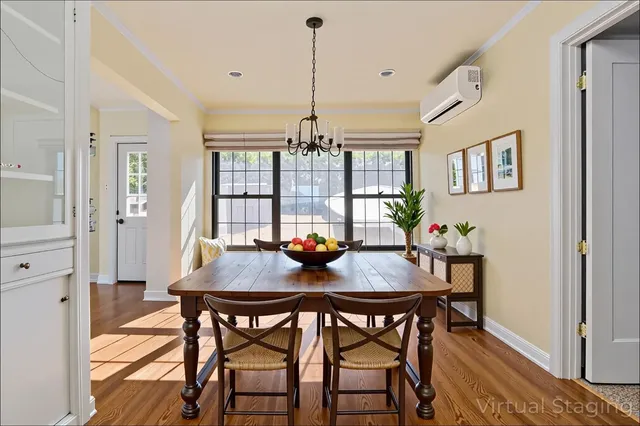 a view of a dining room with furniture window and wooden floor