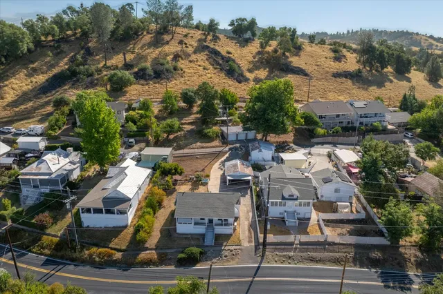 an aerial view of residential building and trees around
