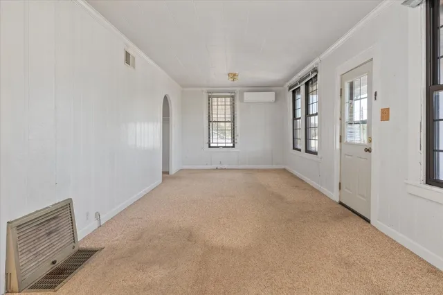 an empty room with windows