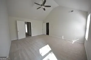 a view of an empty room and a window