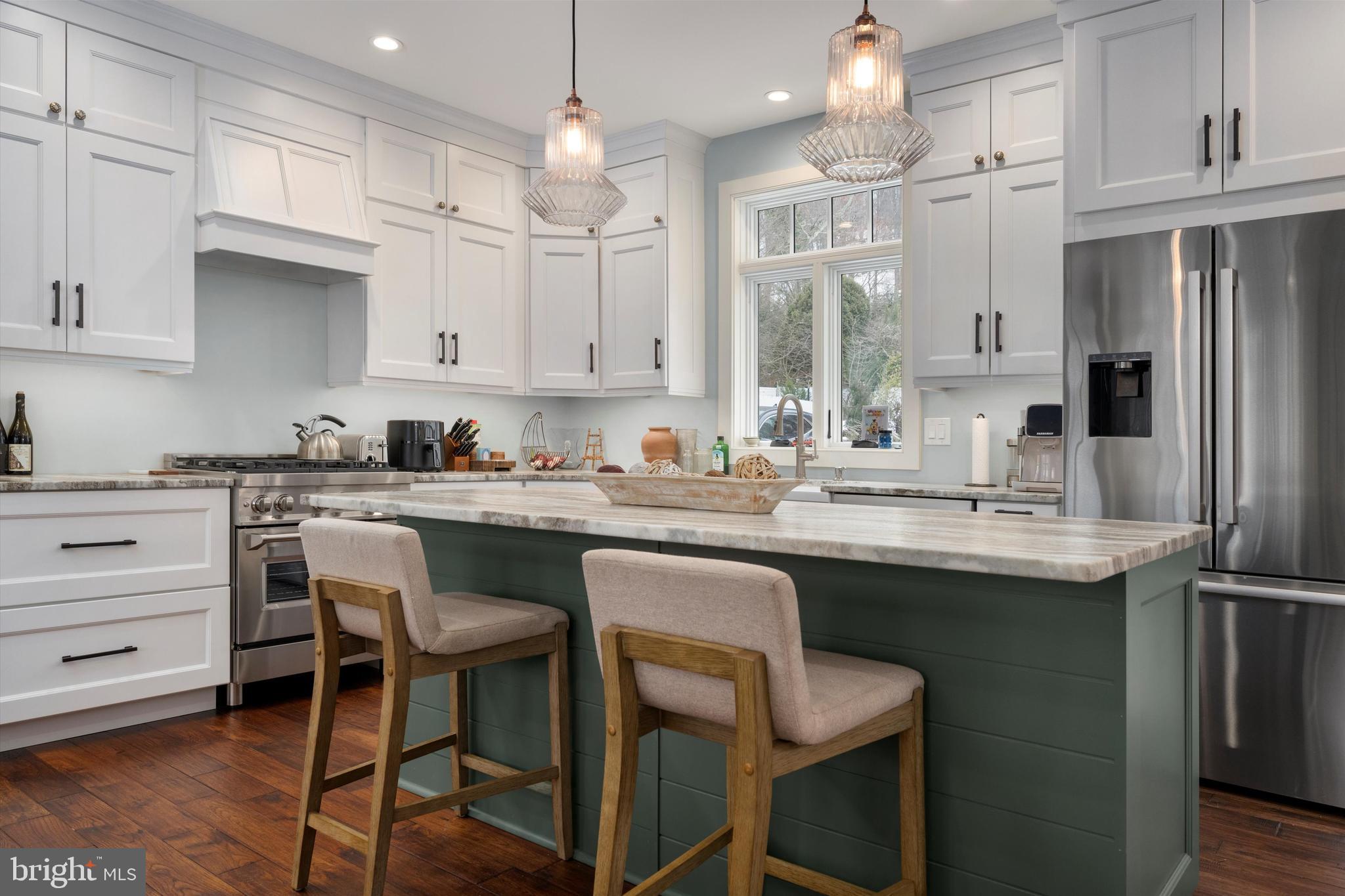 3741 River Road Lumberville, PA 18933 - Photo 12 of 31 a kitchen with kitchen island granite countertop white cabinets and refrigerator