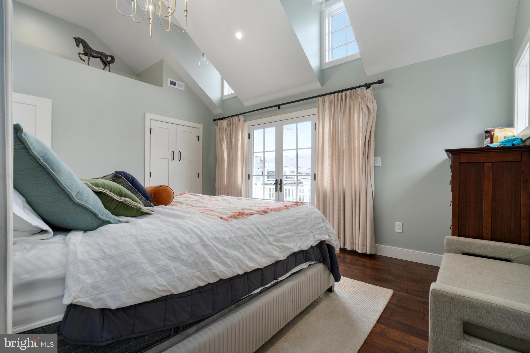 3741 River Road Lumberville, PA 18933 - Photo 19 of 31 a bedroom with a bed and wooden floor