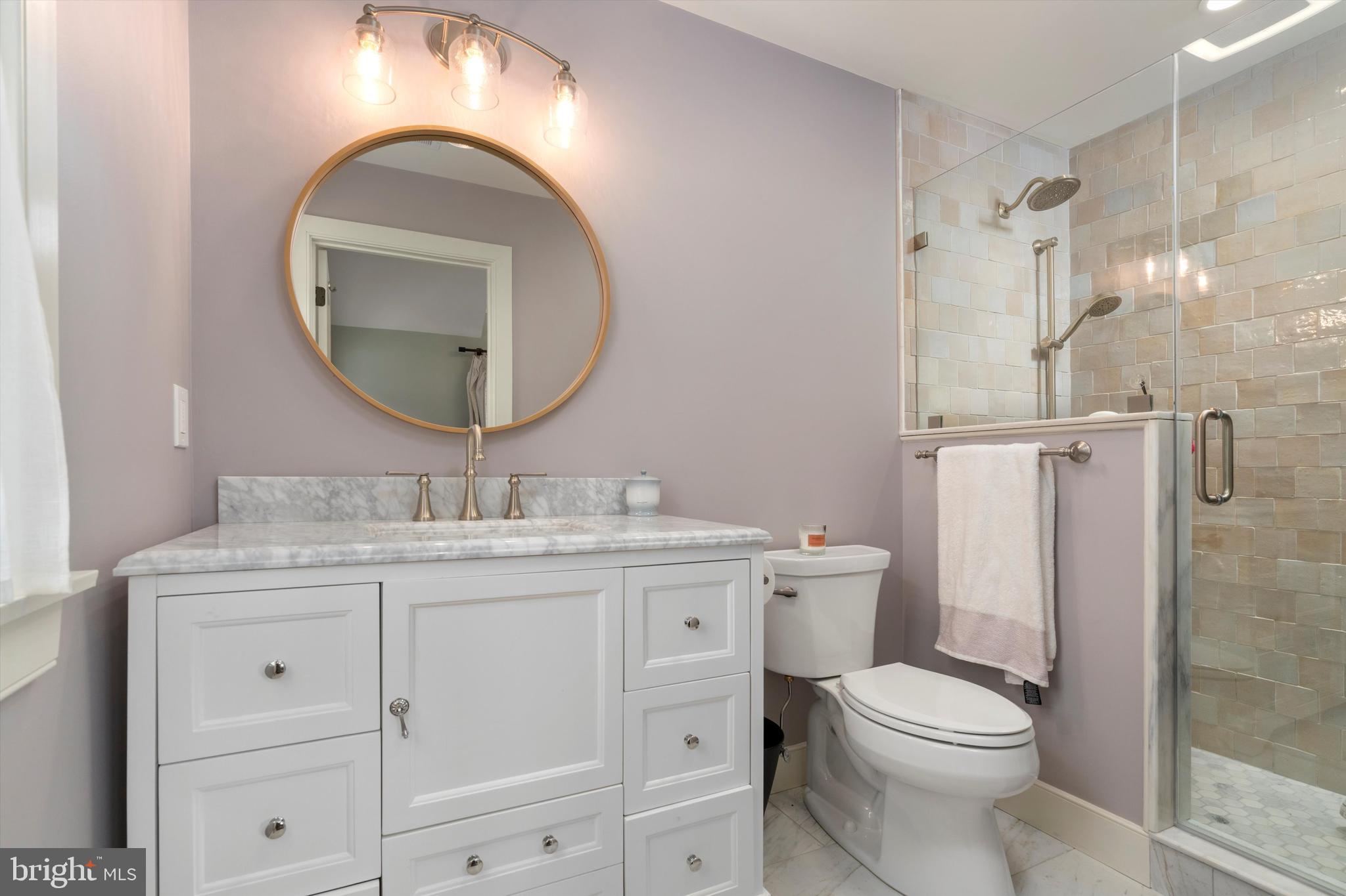 3741 River Road Lumberville, PA 18933 - Photo 20 of 31 a bathroom with a granite countertop toilet a sink and a mirror