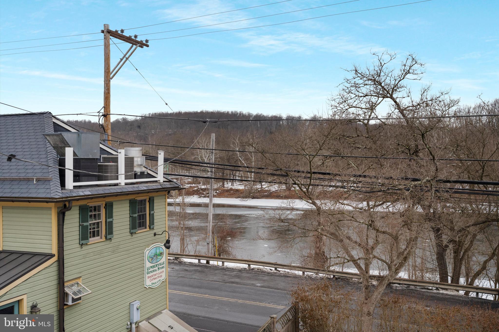3741 River Road Lumberville, PA 18933 - Photo 22 of 31 a view of a balcony with a tree