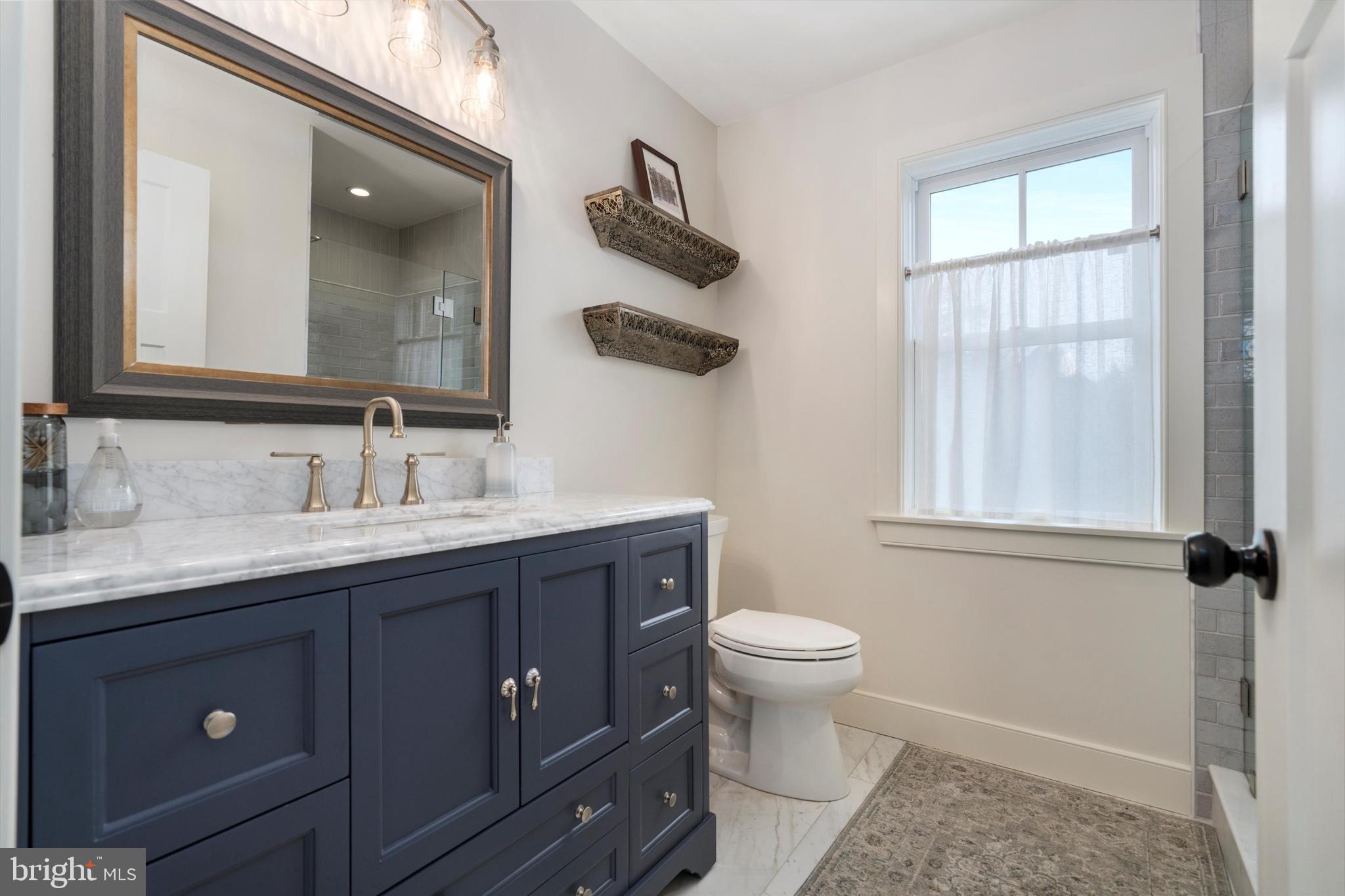3741 River Road Lumberville, PA 18933 - Photo 23 of 31 a bathroom with a granite countertop sink toilet and mirror