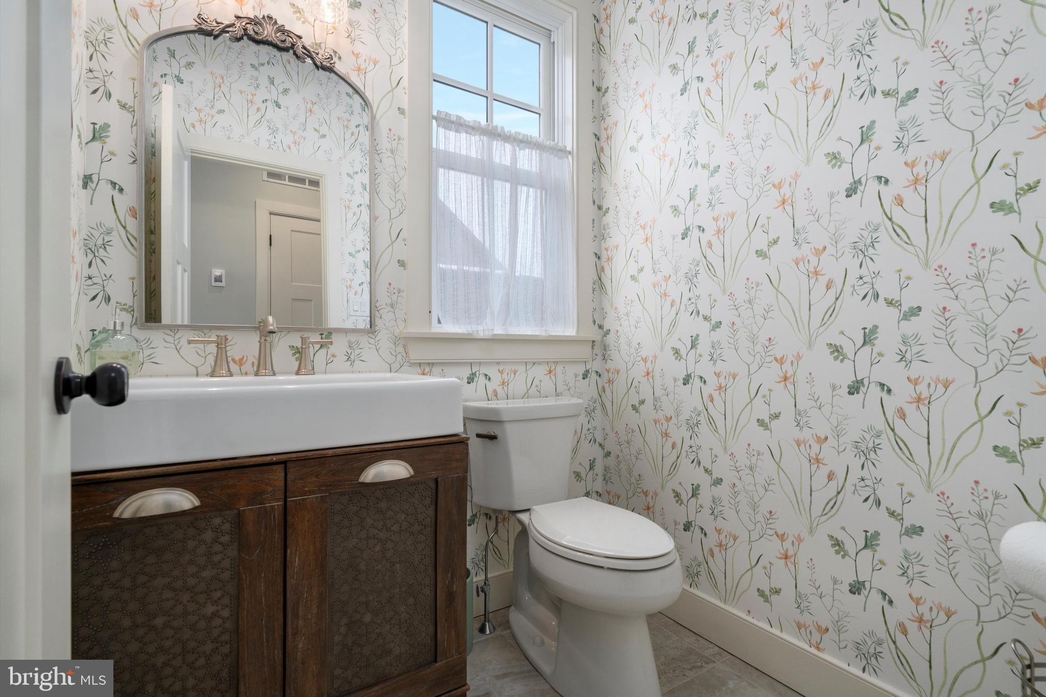 3741 River Road Lumberville, PA 18933 - Photo 7 of 31 a bathroom with a sink a toilet and a mirror