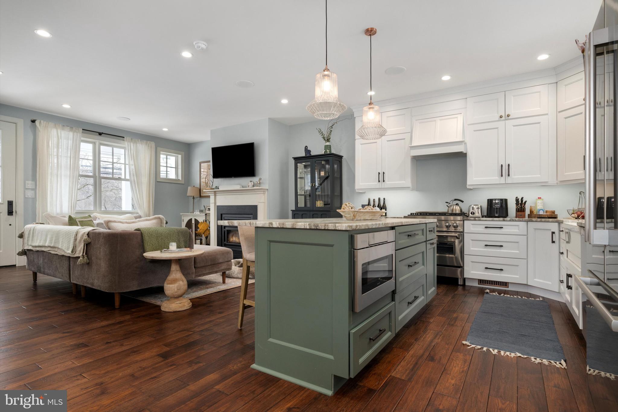 3741 River Road Lumberville, PA 18933 - Photo 8 of 31 a kitchen with microwave a stove and wooden floor