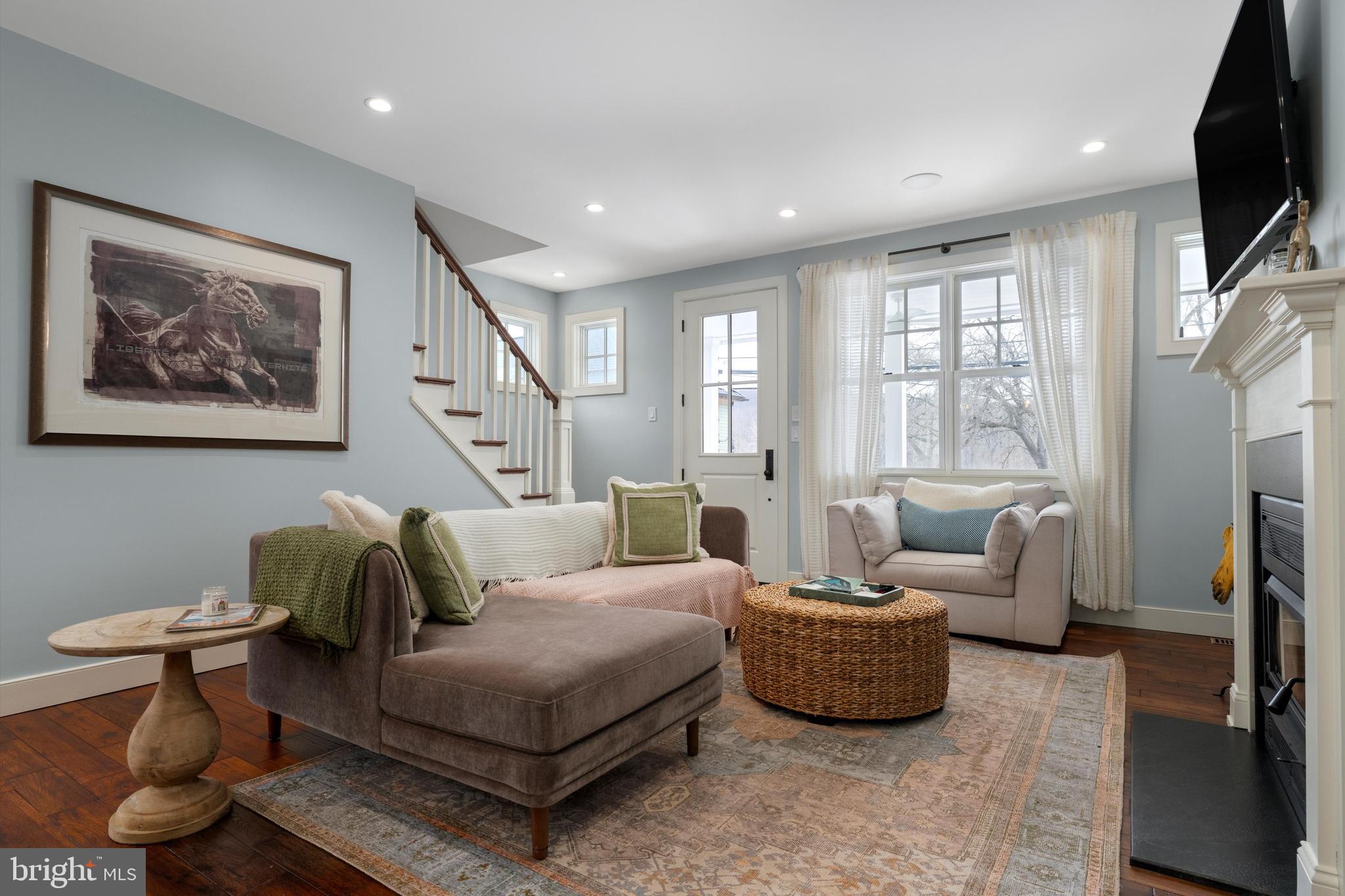 3741 River Road Lumberville, PA 18933 - Photo 10 of 31 a living room with furniture a flat screen tv and a window