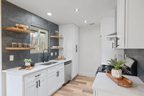 a kitchen with sink and window