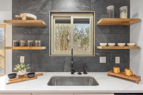 a bathroom with a sink and a window