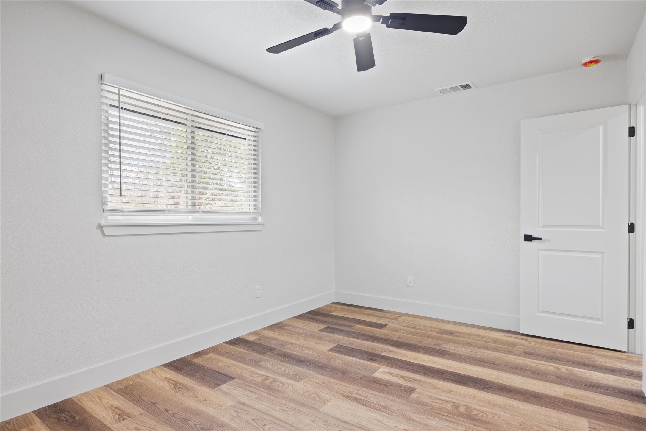 6212 Boxcar Run Austin, TX 78745 - Photo 16 of 36 Empty room featuring light wood-type flooring and ceiling fan