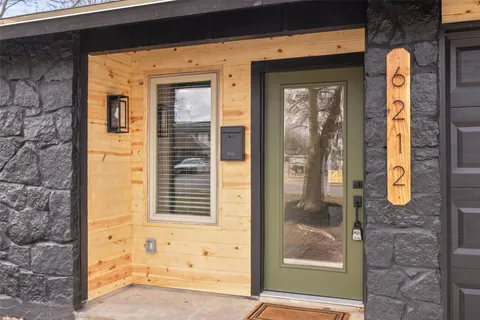 a front view of a house with a glass door
