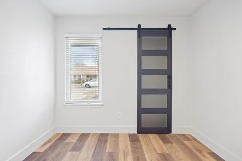 a view of room with window and closet